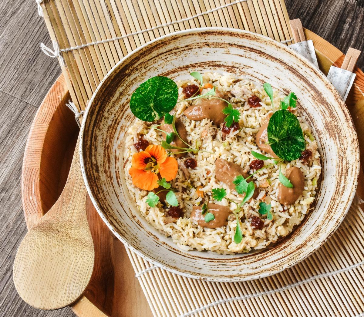 ceramic bowl with fried rice and vegetables